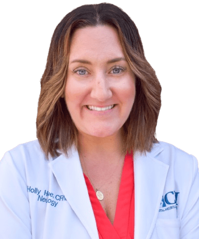 A woman in white lab coat smiling for the camera.